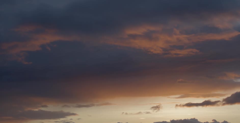 The skyline is heavily cloudy at sunset