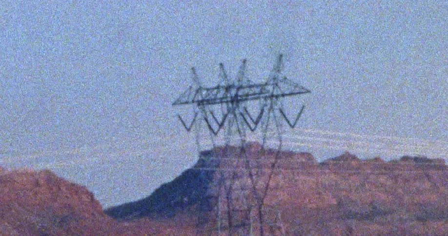 A view of power lines on a tower outdoors