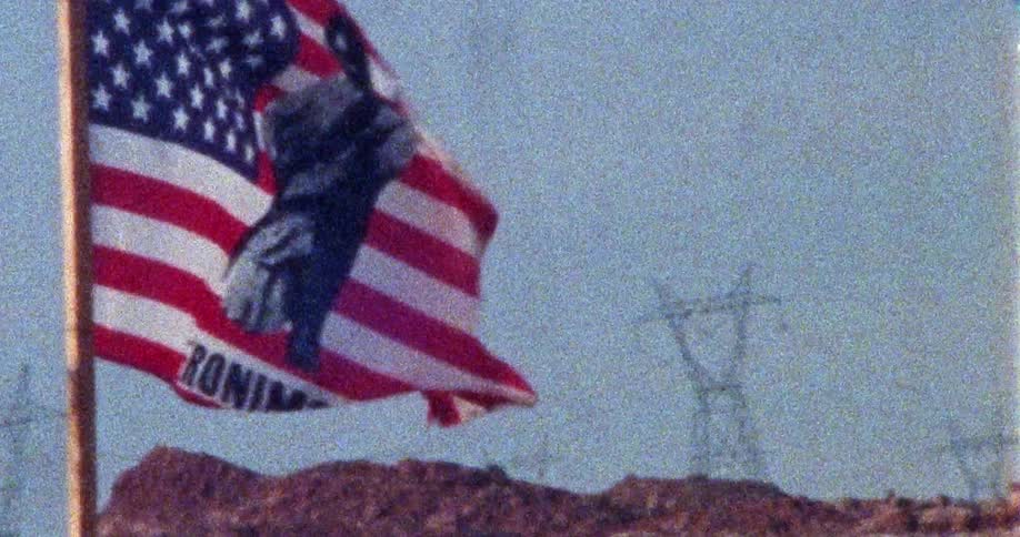An american flag that says geronimo is waving in the wind