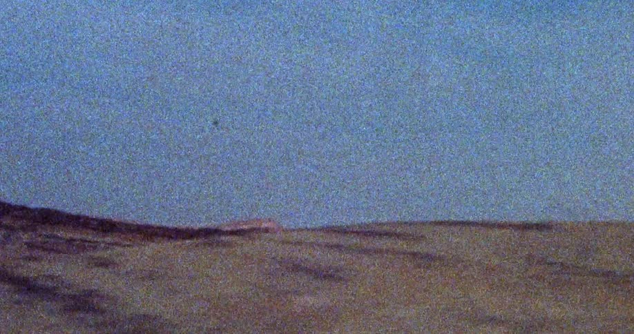 A very pixelated view of mountains and rock formations