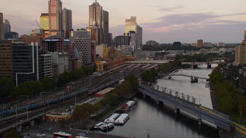 Aerial view of bridges over a river in the city at sunset