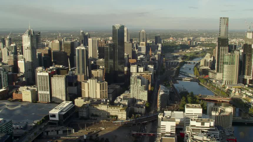 A rotating view of a large city with a river and many roads