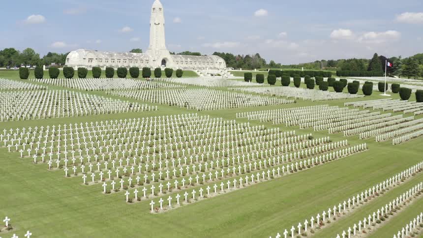 An aerial view of a large national cemetery during the daytime
