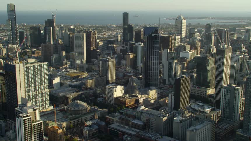Buildings and skyscrapers in a metropolis on the coast during the day