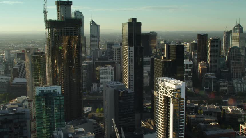 Aerial view of skyscrapers on the city skyline at sunset