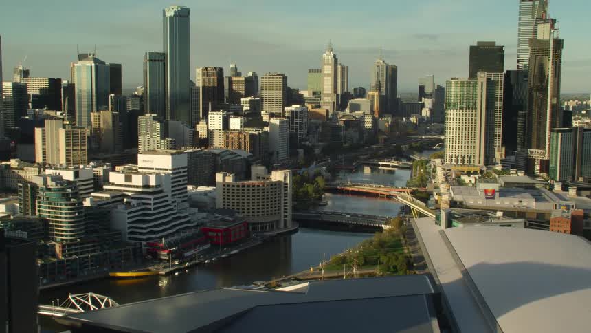 Aerial view of high rise buildings and office buildings next to river