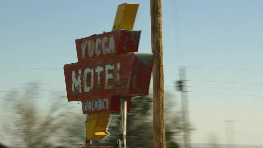 Vintage motel sign in a small town at morning