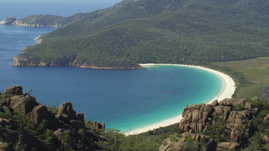 Blue waters surround the shore