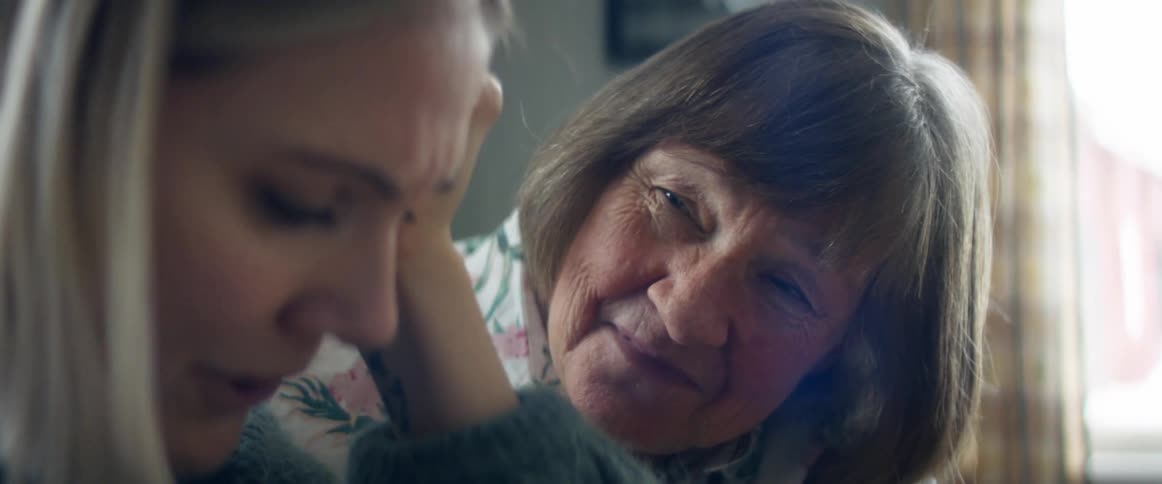 A mother talking to her daughter that is crying