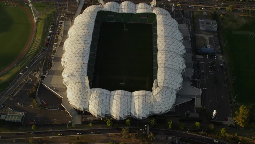 Traffic moves past the stadium