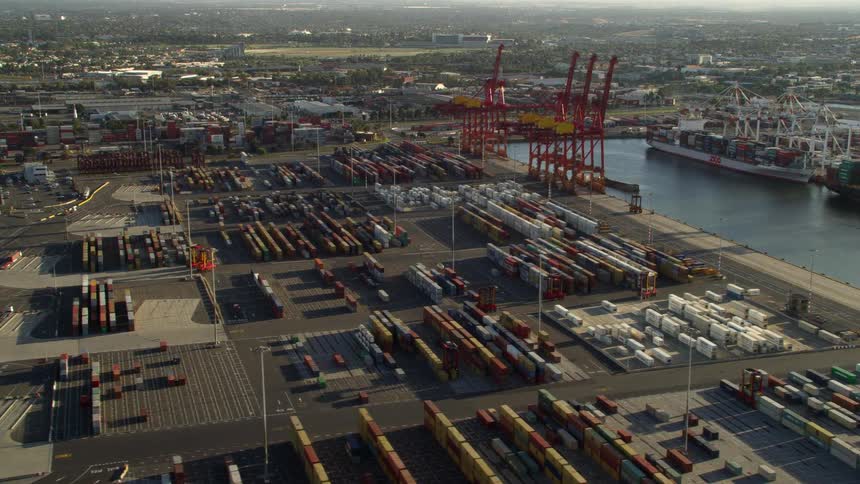 A shipping yard on the cost during the day