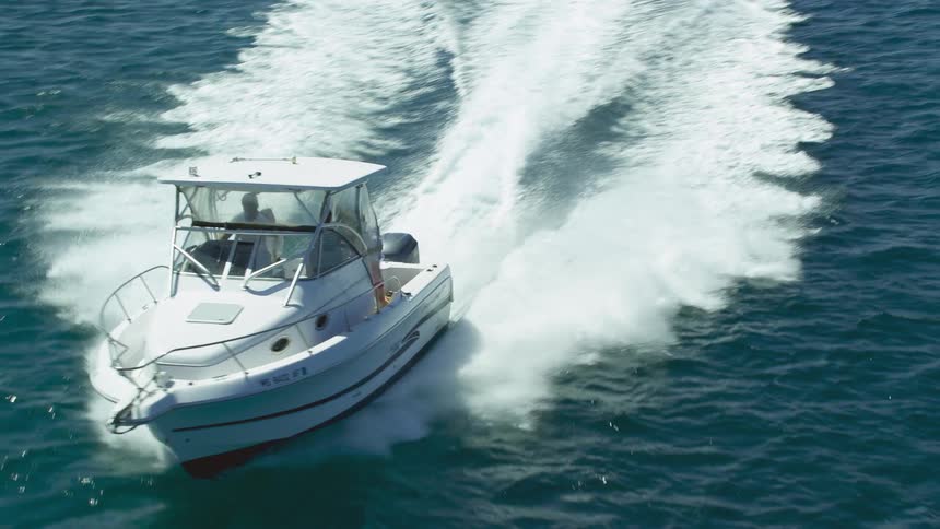 People are traveling on a speed boat in the water