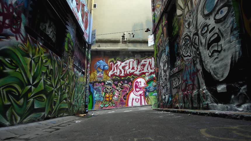 The walls of the buildings are covered in graffiti