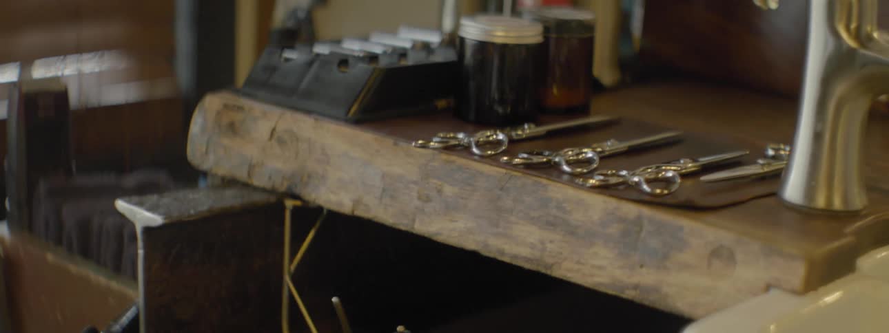 A desk covered in barber shop tools