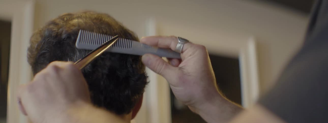 A man gets his hair cut