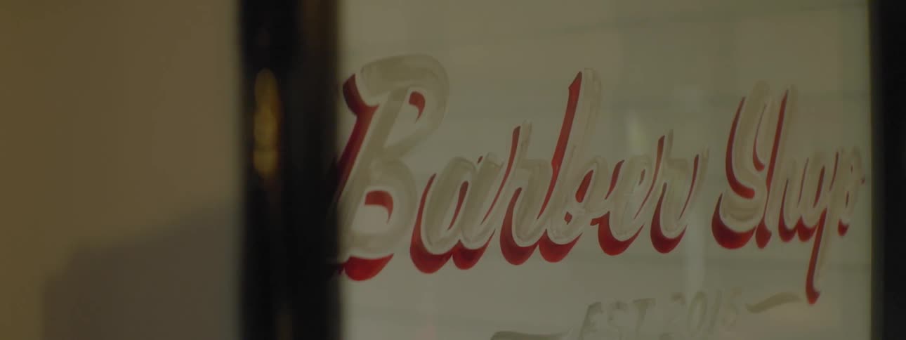 The advertisement for a barber shop