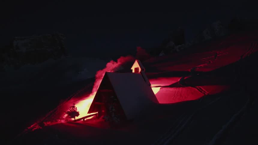 A building is on fire in the night