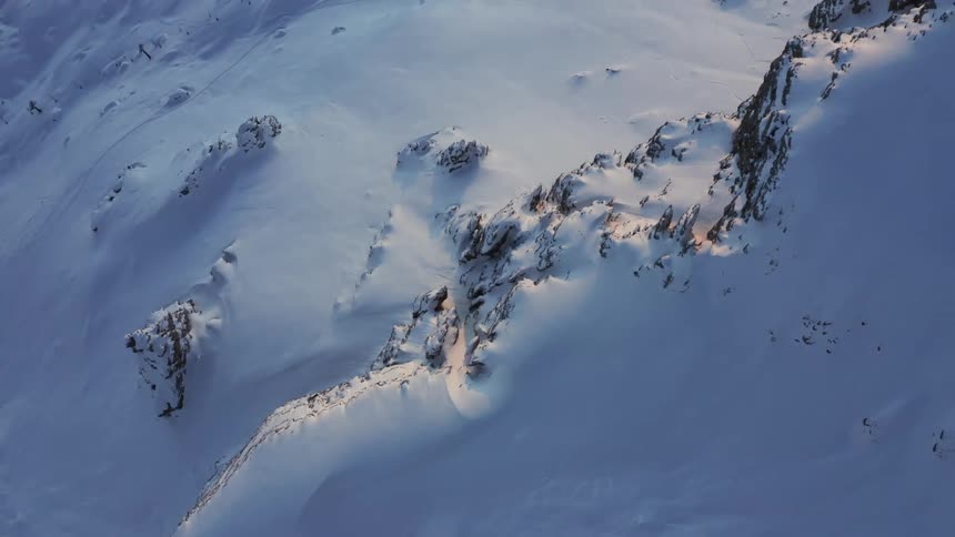 A mountain range covered in snow and ice