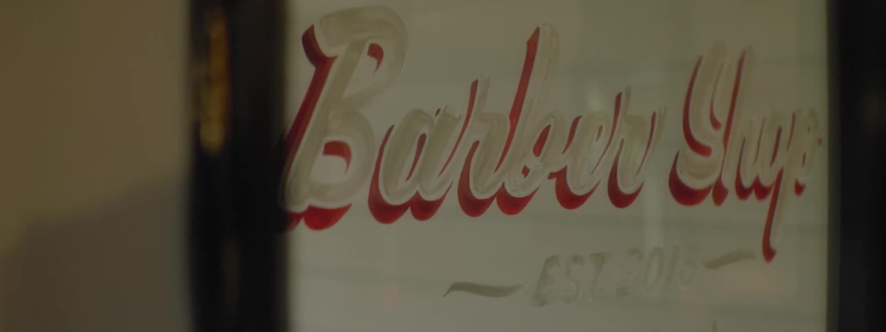 The word barber on a door