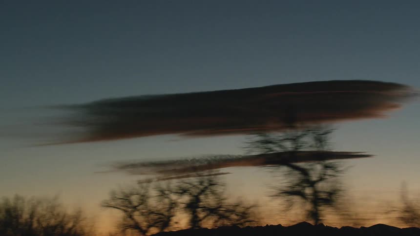 The sun setting over the hills