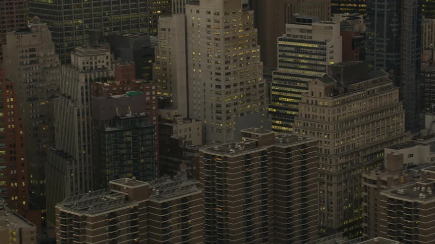 Aerial view of skyscrapers on the city skyline at evening