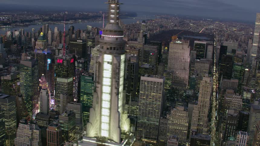 Aerial view of city skyscrapers with spires and high rise buildings at dawn in the city