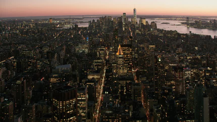 A city skyline with buildings and skyscrapers with the sky and clouds in the background