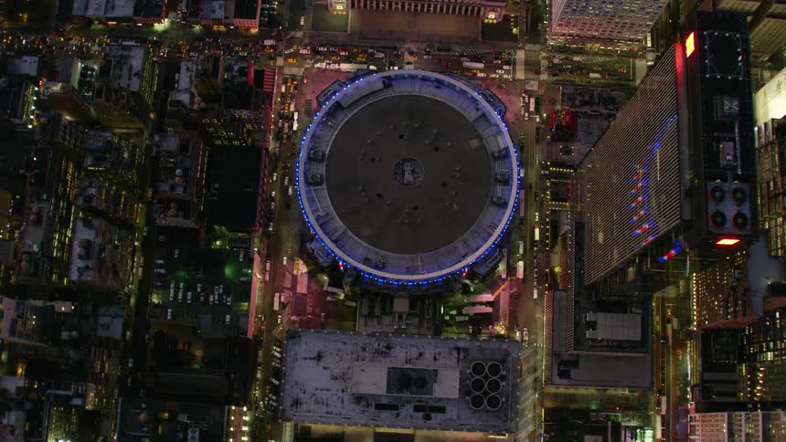An aerial view of buildings in a city at night