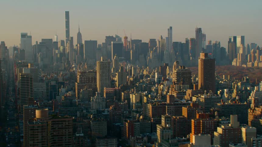 An aerial view of a city skyline with high rise office buildings
