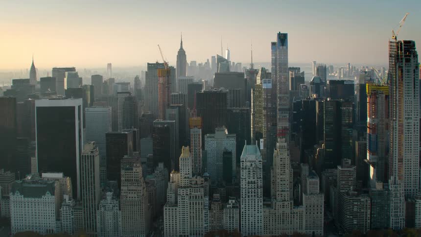 Buildings and sky scrapers in new york city at sunset