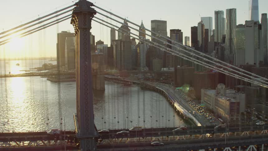 Heavy traffic passes along a bridge leading to and from downtown