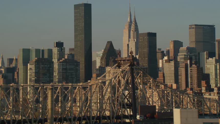 A bridge and tall buildings in a metropolis during the day