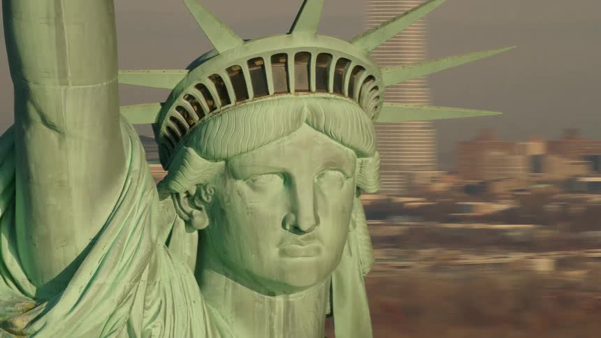 Aerial view of the statue of liberty in front of new york city