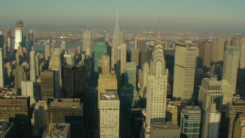 Tall buildings line the city on a foggy day