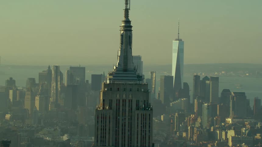 Haze obscures downtown skyscrapers and nearby water