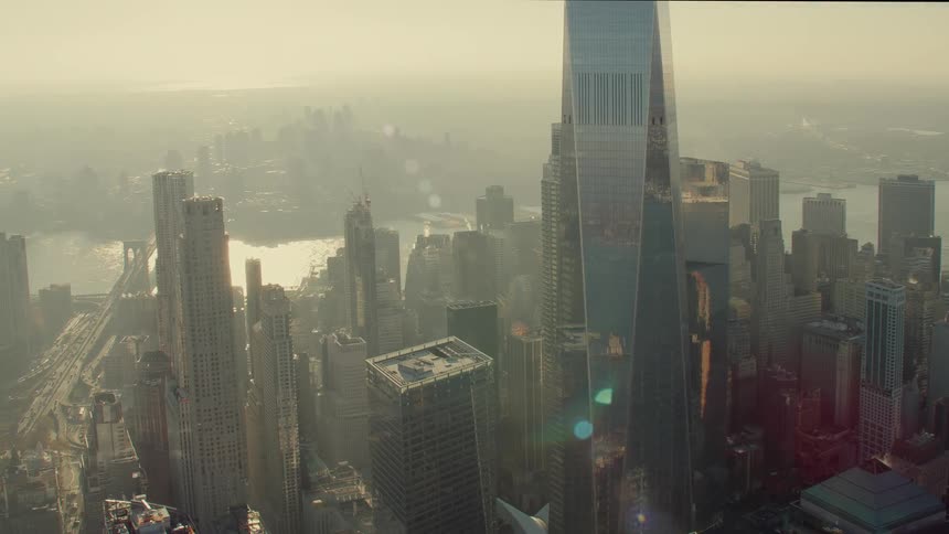 A city skyline with buildings and skyscrapers with the sky and clouds in the background
