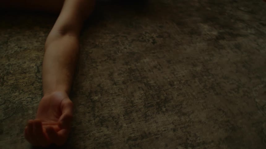 A man is having a seizure on the ground