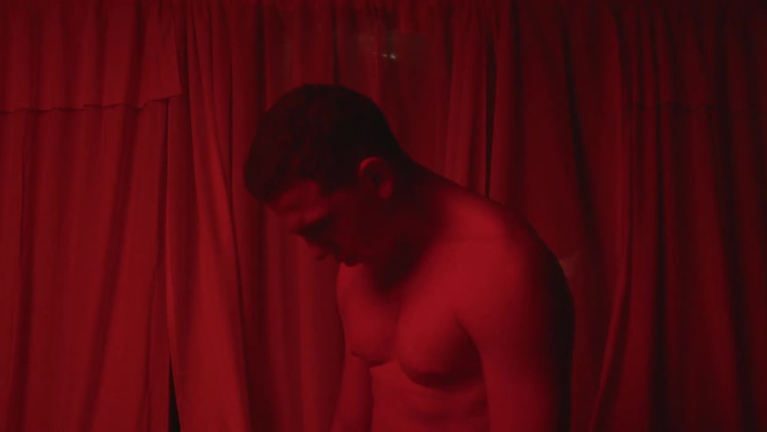 A man standing in a red room