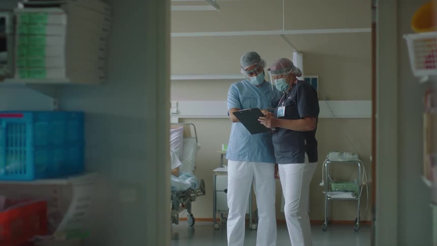 People talk and walk through the hospital