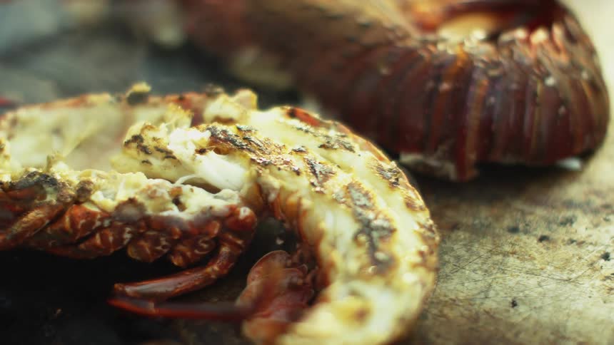Seafood is flipped on the stove