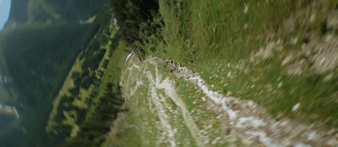 Aerial view of a river flowing down the slopes of a mountain