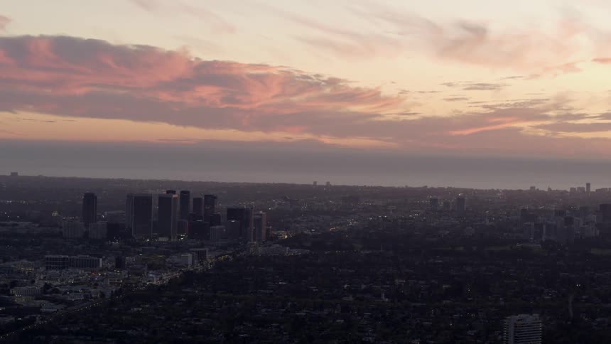 The sun sets over West Los Angeles with Beverly Hills in the foreground