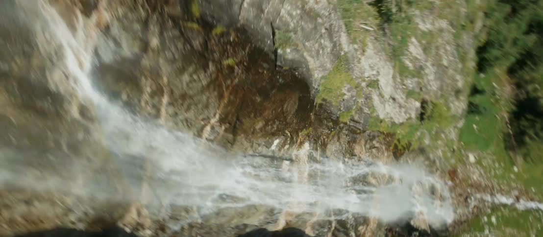 A waterfall flowing down the side of a mountain
