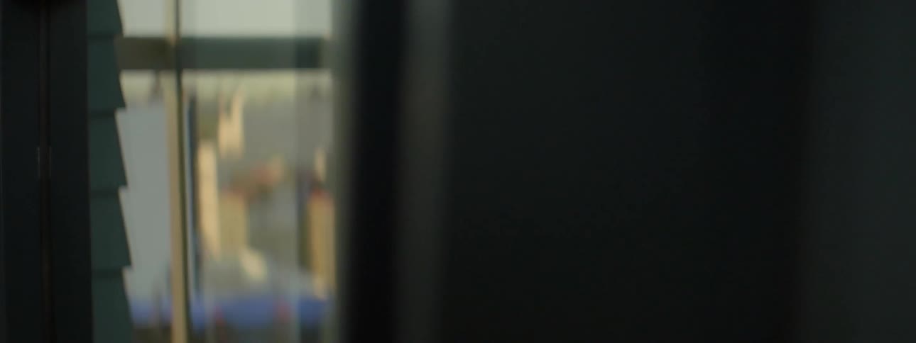 A woman is reflected in the glass