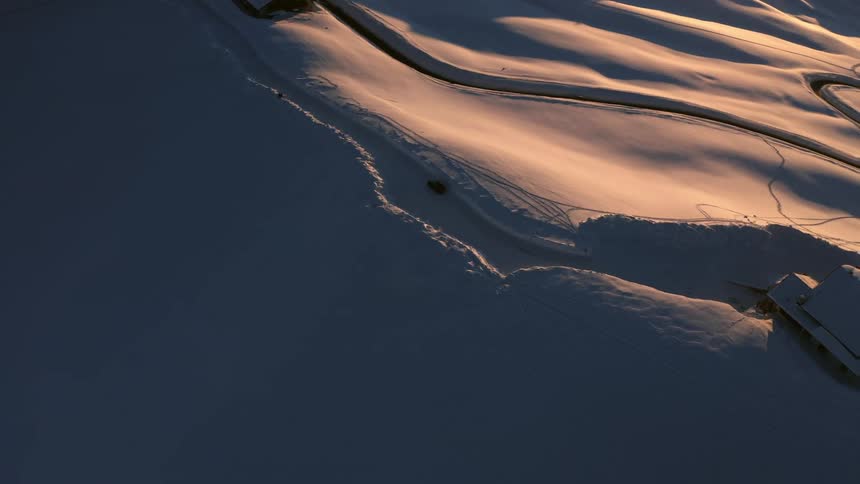 A landscape with snow ice houses and trees
