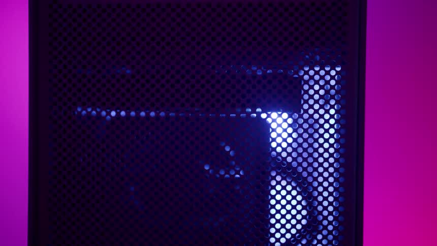 Lights change colors as fan rotates behind black mesh