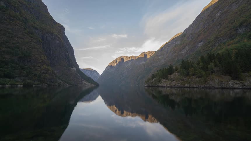 Time lapse of a river between the mountains at morning