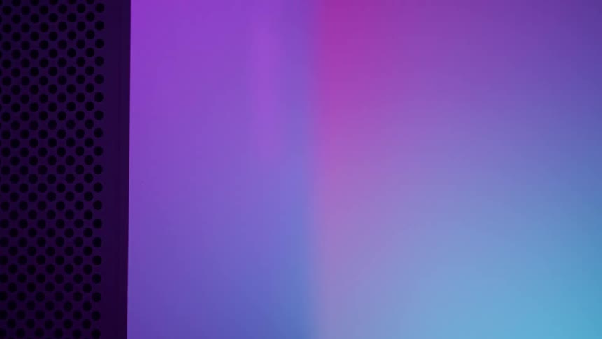 Computer standing near multicolor display of lights