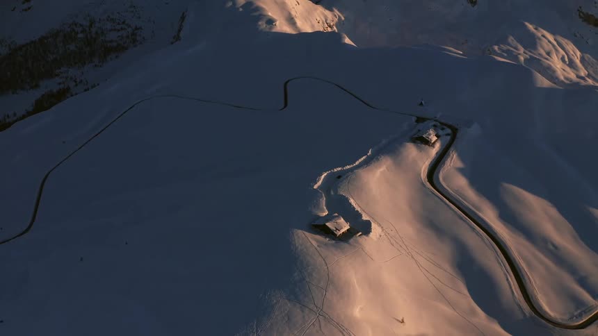An aerial view of a snow covered mountain