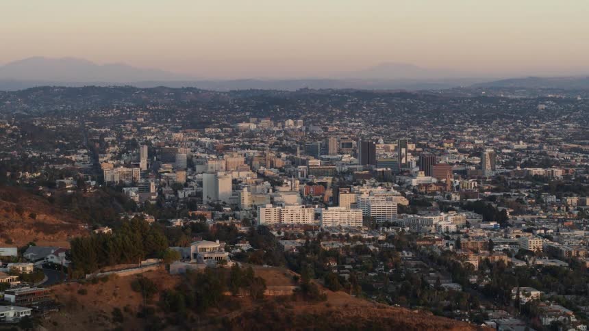 Hollywood Strip and Sunset Boulevard appear in the distance as seen from Hollywood Hills